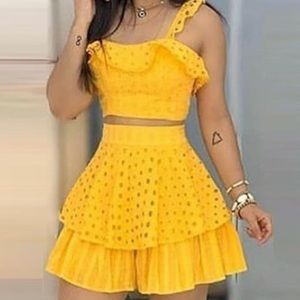 Yellow two piece romper skirt set in a size large